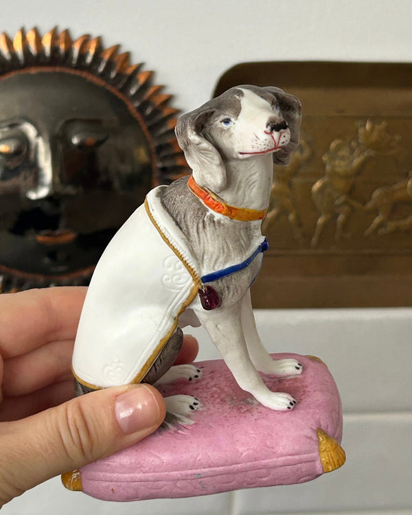 Porcelain Dog Figurine on Pink Cushion